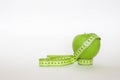 Green apple and the ruler Royalty Free Stock Photo
