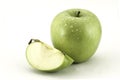 Green apple and a slice of apple on white background Royalty Free Stock Photo