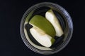 Green apple slice on plastic container. Dietary foods and weight loss concept