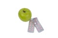 Green apple and slimming pills . Royalty Free Stock Photo