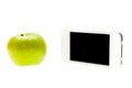Green apple and smartphone isolated on the white