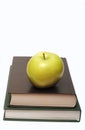 Green apple on stack of book Royalty Free Stock Photo