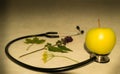 Green apple, stethoscope Royalty Free Stock Photo