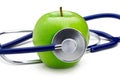 Green apple with stethoscope