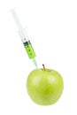 Green apple with syringe inserted Royalty Free Stock Photo