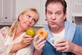 Green Apple vs. Donut Healthy Eating Decision Royalty Free Stock Photo