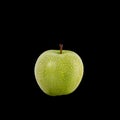 Green apple with water drop. Studio shot isolated on black Royalty Free Stock Photo