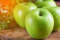 Green apple with water drop on wood table Royalty Free Stock Photo