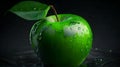 Green apple with water drops on a black background, close-up Royalty Free Stock Photo