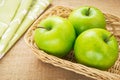 Green apple in wicker basket, filtered image