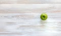 Green apple on wood background Royalty Free Stock Photo