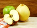 Green apple yellow chinese pear and red apple on wooden background Royalty Free Stock Photo