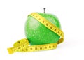 Green apple with yellow measuring tape