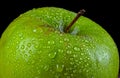 green applec overed in water drops Royalty Free Stock Photo