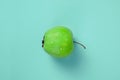 Green apples on a blue background flat