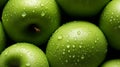 Green apples close-up. Fresh green apple on a black texture background. Apple with droplets of water. Healthy food for vegetarians Royalty Free Stock Photo