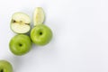 Green apples with cut in half slices isolated on white background, healthy organic apples for cooking, organic fruits concept Royalty Free Stock Photo