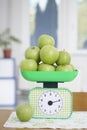 Green apples on kitchen scale food fruit Royalty Free Stock Photo