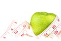 Green apples measured the meter on a white. Healthy lifestyle and diet concept background