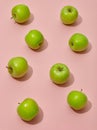 Green apples on pink background Royalty Free Stock Photo