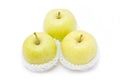 Green apples in white packaging.