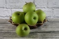 Green apples in a wood basket Royalty Free Stock Photo