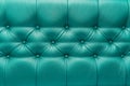 Green or aquamarine leather upholstery sofa with pattern button design furniture style decor texture background Royalty Free Stock Photo