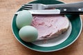 Green eggs and ham on a plate