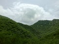 Green Aravali hills and sky from sajjangarh palace in udaipur city