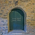 Green arched door, night view, Chios island