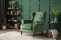 Green armchair and decoration room on dark green wall Royalty Free Stock Photo