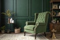 Green armchair and decoration room on dark green wall Royalty Free Stock Photo