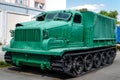 Green armored tracked military tractor