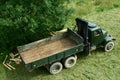 Green army truck from 1950s modified for timber transport