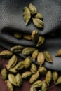 Green aromatic cardamom on fabric