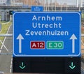 Green arrow above the driving lane indicating that its open on motorway A12 E30 heading Arnhem, utrecht and Zevenhuizen