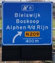 Green arrow above the driving lane indicating that its open on motorway A12 E30 heading Arnhem, utrecht and Zevenhuizen and juncti