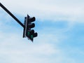 Green arrow symbol on traffic light against blue sky Royalty Free Stock Photo