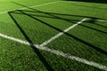 Green artificial grass football or soccer field with white line background Royalty Free Stock Photo