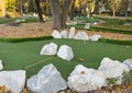 green artificial grass and rocks on miniature golf course Royalty Free Stock Photo