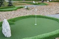 green artificial grass and rocks on miniature golf course Royalty Free Stock Photo