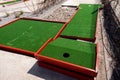 green artificial grass and rocks on miniature golf course Royalty Free Stock Photo