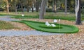 green artificial grass and rocks on miniature golf course Royalty Free Stock Photo