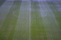 Green artificial grass soccer field with white line and center circle. Royalty Free Stock Photo