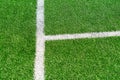 Green artificial grass turf soccer football field background with white line boundary. Top view Royalty Free Stock Photo