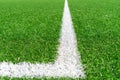 Green artificial grass turf soccer football field background with white line boundary. Top view Royalty Free Stock Photo