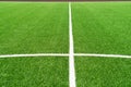 Green artificial grass turf soccer football field background with white lines. Top view Royalty Free Stock Photo