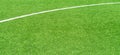 Green artificial grass turf soccer football field background with white lines. Top view Royalty Free Stock Photo