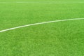 Green artificial grass turf soccer football field background with white lines. Top view Royalty Free Stock Photo