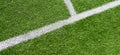 Green artificial grass turf soccer football field background with white lines. Top view Royalty Free Stock Photo